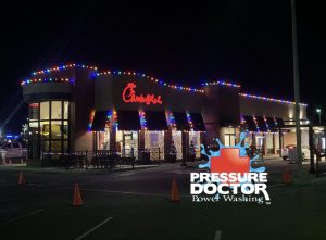 Chick Fil A with Christmas lights and Pressure Doctor logo