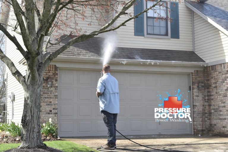 pressure doctor professional cleaning roof over garage