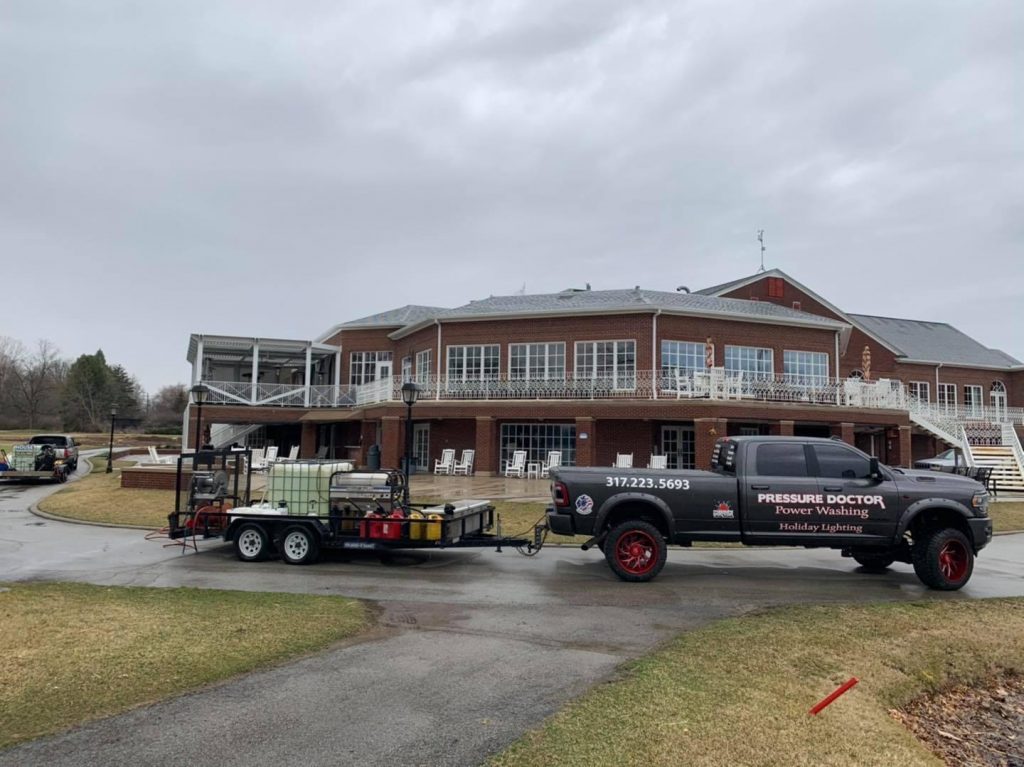 commercial business with black pressure doctor work truck