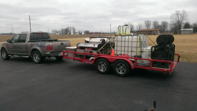 about page gray pressure doctor work truck with pressure washing equipment in red trailer Indianapolis, IN