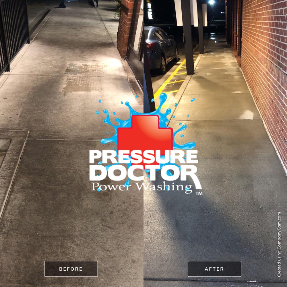 cleaning concrete with pressure washer