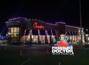 Chick Fil A with Christmas lights and Pressure Doctor logo Indianapolis, IN